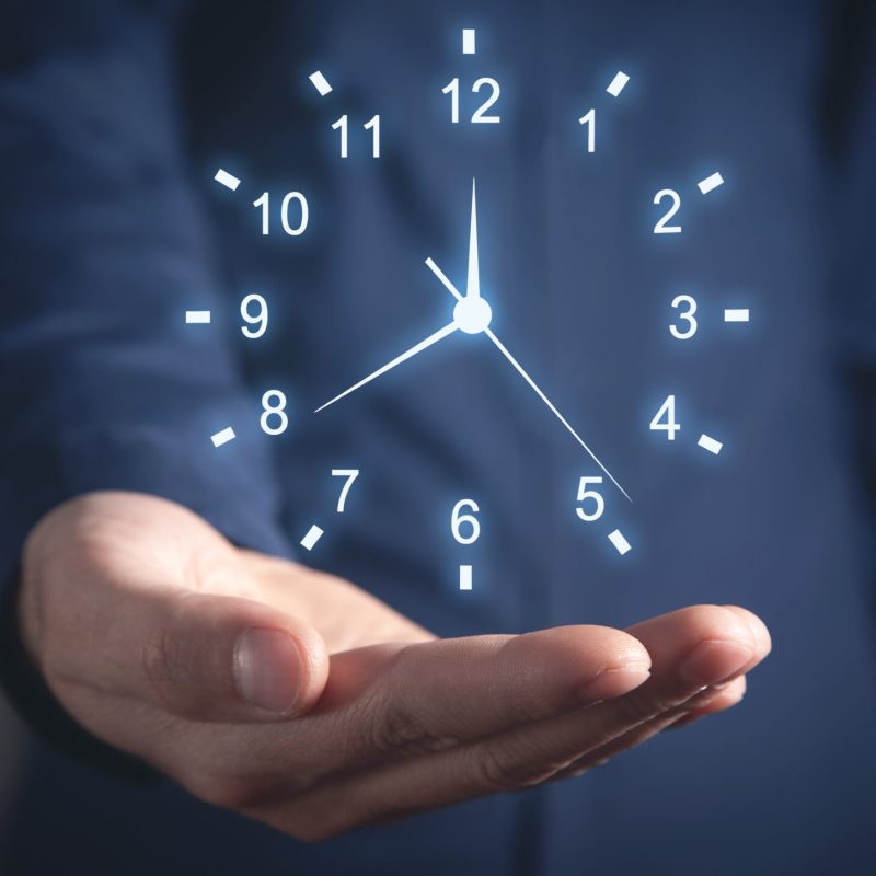 Caucasian businessman showing clock. Time Management